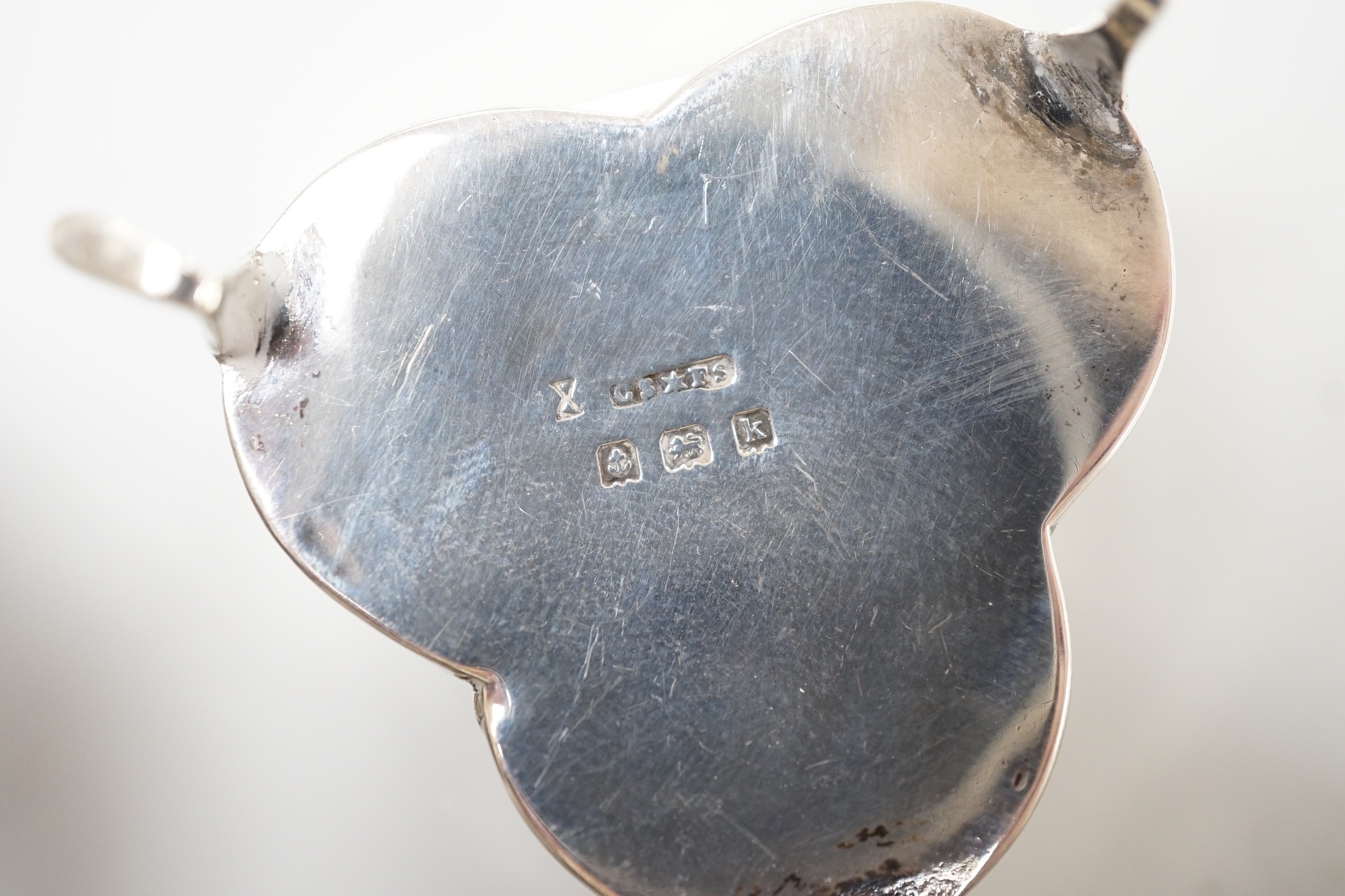 Three Victorian/Edwardian repousse silver heart shaped trinket boxes, largest 56mm and a similar mother of pearl inlaid 'pansy' trinket box, by Saunders & Shepherd, gross weight 1106 grams.